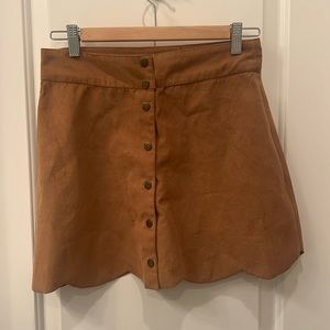 Suede skirt with petal like pattern on the hem. Size small. Forever21